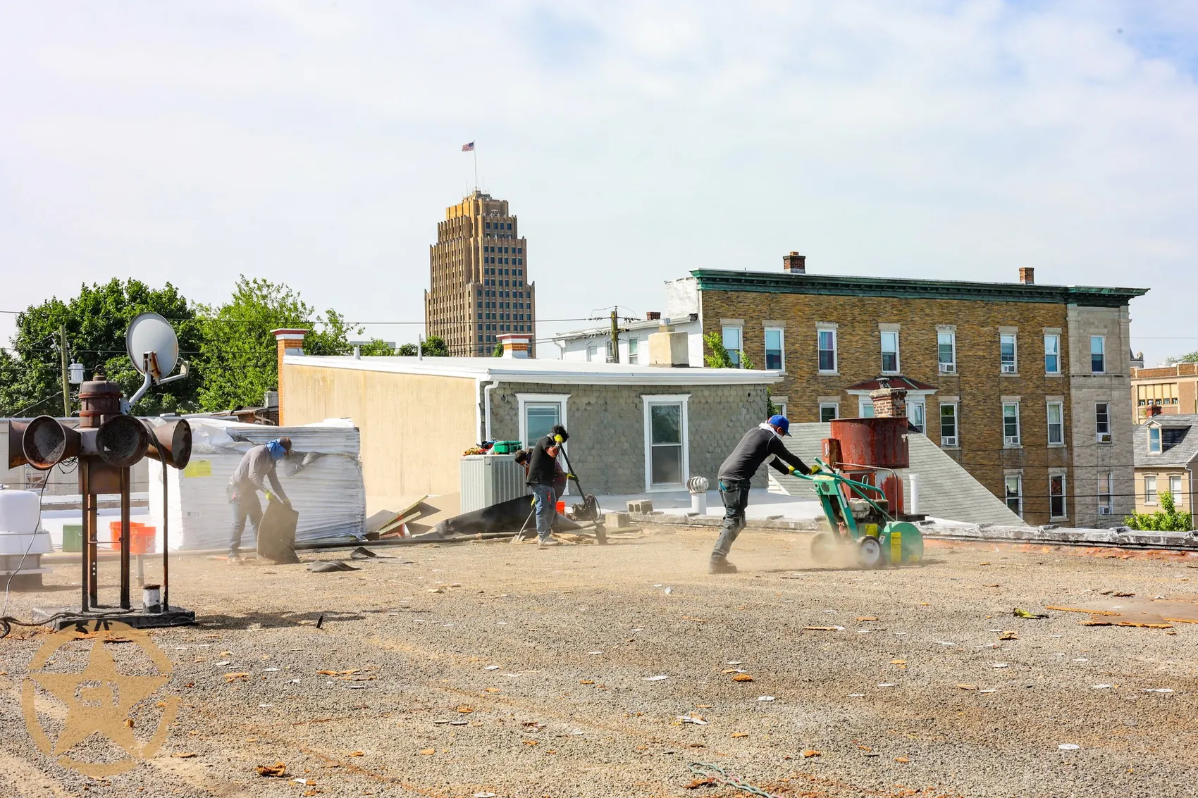 Crew working on a steep residential roof replacement